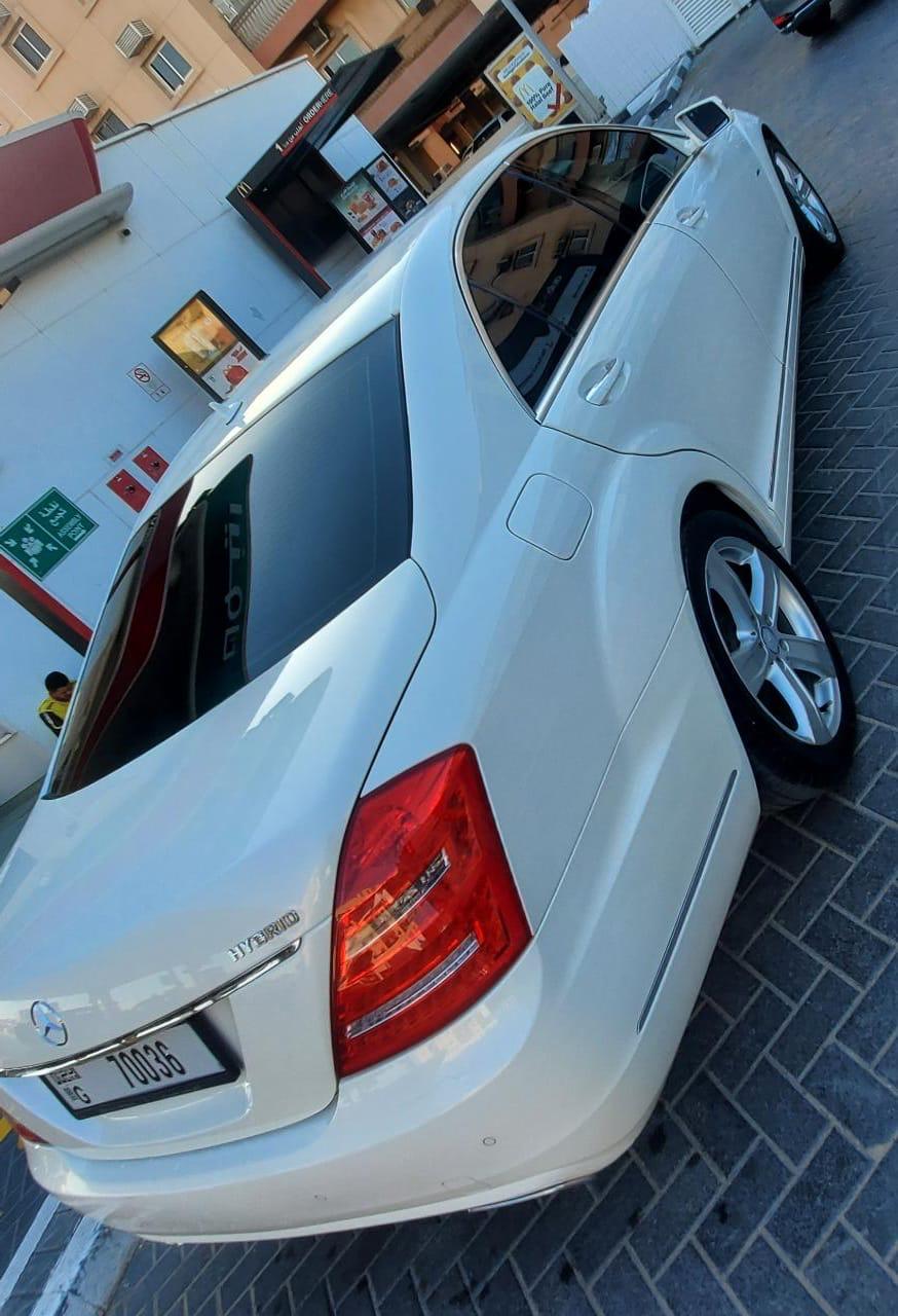 White Mercedes Benz S 400 h 2011